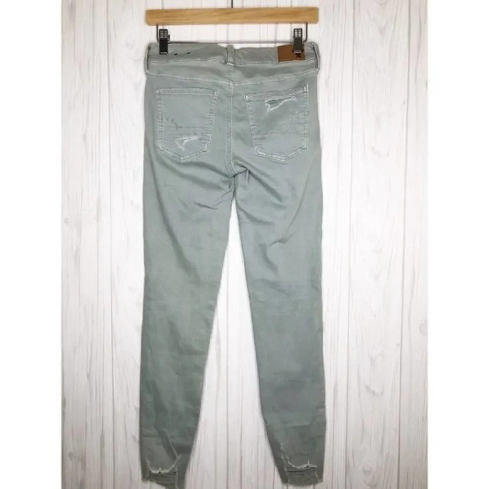 AMERICAN EAGLE Seafoam Destroyed Skinny Jeans